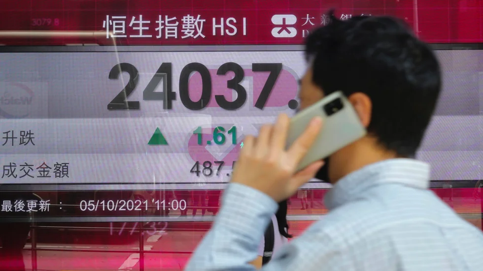 Glada miner för Hang Seng-index. Arkivbild.