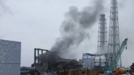 In this photo released by Tokyo Electric Power Co. (TEPCO), gray smoke rises from Unit 3 of the tsunami-stricken Fukushima Dai-ichi nuclear power plant in Okumamachi, Fukushima Prefecture, Japan, Monday, March 21, 2011. Official says the TEPCO temporarily evacuated its workers from the site. At left is Unit 2 and at right is Unit 4. (AP Photo/Tokyo Electric Power Co.) EDITORIAL USE ONLY