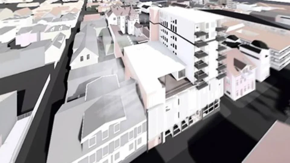 En volymstudie av hur ett högt hus skulle kunna se ut på platsen.