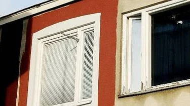 Ska Centrumhusets betong få en tegelröd nyans?