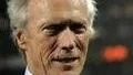 US actor Clint Eastwood looks on after he kicked the ball to start the French League One soccer match between Lyon and Sochaux, in Lyon, central France, Saturday, Oct. 17, 2009. (AP Photo/Laurent Cipriani)