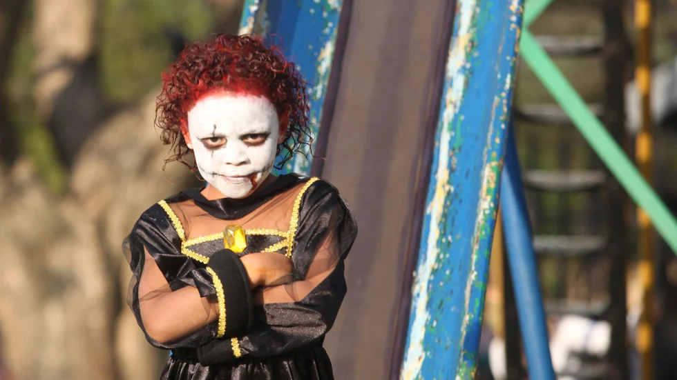 A child poses for photos during a Halloween party in a Johannesburg Suburb, Friday, Oct. 31, 2014. (AP Photo/Denis Farrell)