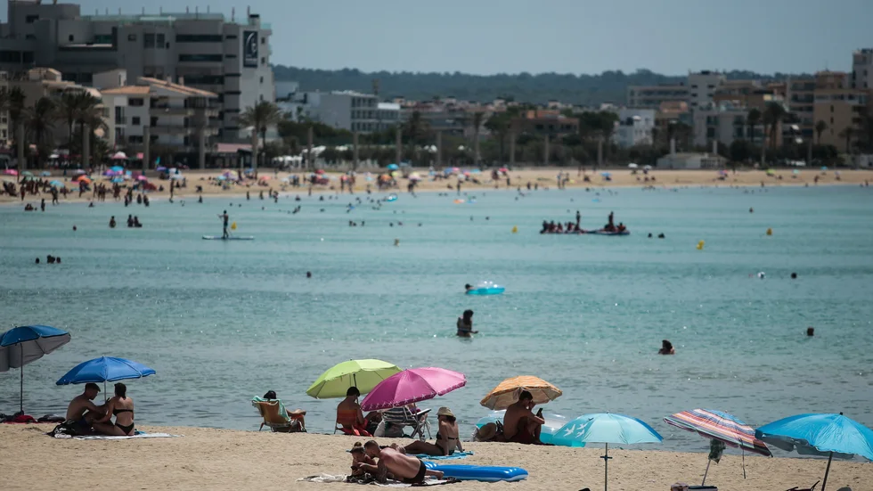Stranden i Palma de Mallorca i Spanien i juli förra året.