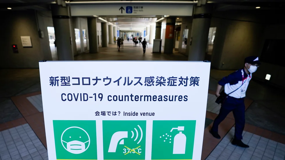 I presscentret i Tokyo uppmanas OS-journalister och -fotografer att bära munskydd och tvätta händerna.