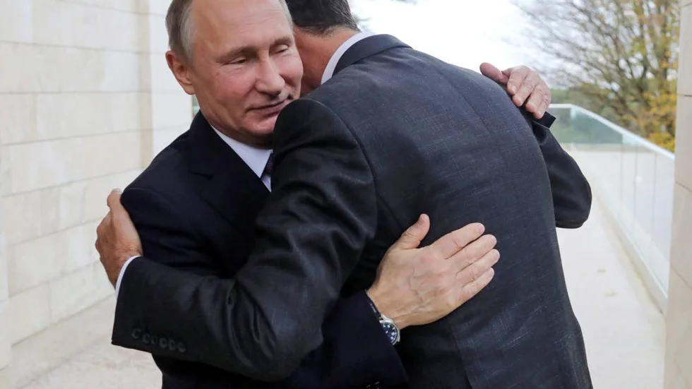 Putin kramas. Här dock inte med en miljöpartist, utan med Syriens president Bashar al-Assad.