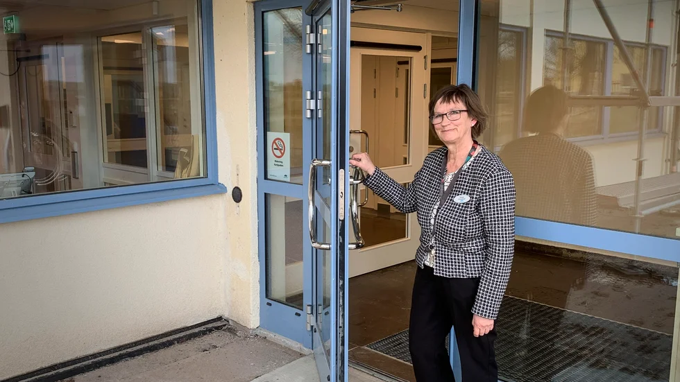 Kirsti Honkanen öppnar dörren till de nya lokalerna.