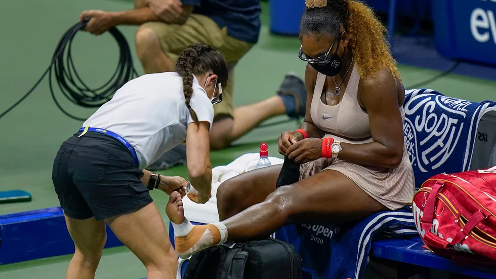 Serena Williams ådrog sig en hälskada i US Open-semin mot Victoria Azarenka.
