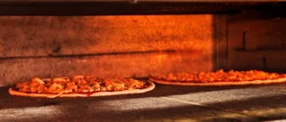Kvinna fick en glasbit i pizzan