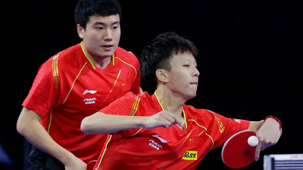 Liang Jingkun, vänster, ska ha fått en rasistisk kommentar riktad mot sig.