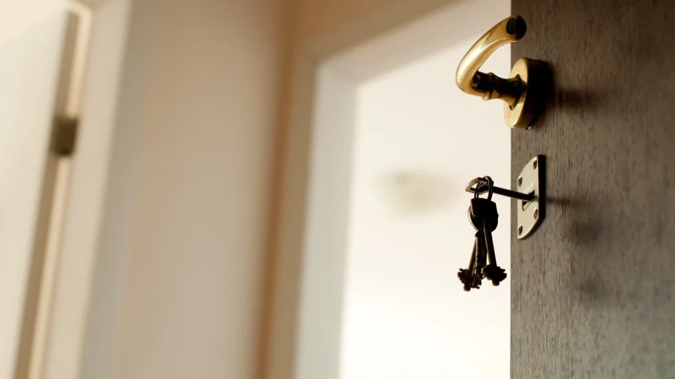 Open door with keys. Real estate