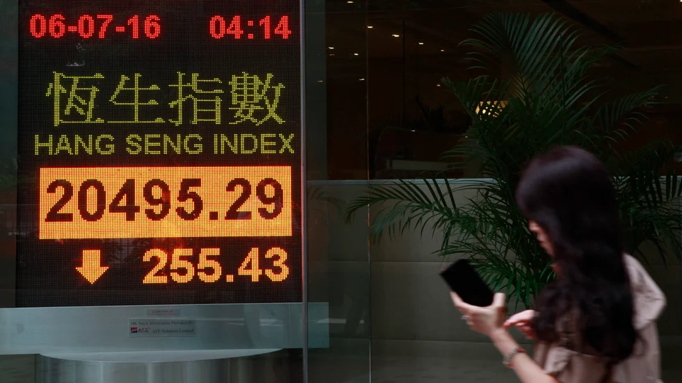 Muntra börsminer i Hongkong. Arkivbild.