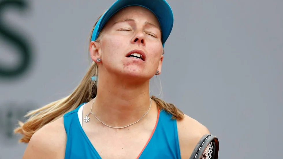 Sweden's Johanna Larsson closes her eyes after missing a shot against Spain's Garbine Muguruza during their second round match of the French Open tennis tournament at the Roland Garros stadium in Paris, Wednesday, May 29, 2019. (AP Photo/Christophe Ena )