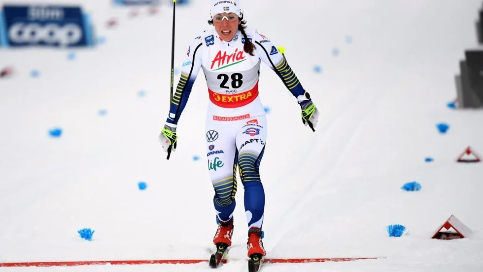 Charlotte Kalla of Sweden crosses the finish line of the women's cross country 10 km classical event of the FIS World Cup Ruka in Kuusamo, Finland, Saturday, Nov. 30, 2019. (Heikki Saukkomaa/Lehtikuva via AP)  TKSJ811