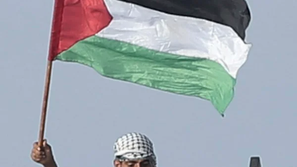 Palestinian protesters gather at the border fence with Israel during a protest near Beit Lahiya, northern Gaza Strip, Monday, Oct. 8, 2018.(AP Photo/Khalil Hamra)