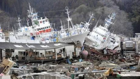 Ships are left aground among destroyed houses in Kesennuma, Miyagi Prefecture, Wednesday, March 16, 2011, five days after an earthquake-triggered tsunami devastated northeastern Japan. (AP Photo/Kyodo News) JAPAN OUT, MANDATORY CREDIT, NO LICENSING IN CHINA, HONG KONG, JAPAN, SOUTH KOREA AND FRANCE