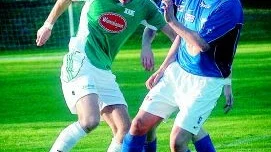 Målskytt. Loftahammars fyramålsskytt Martin Krüger, till vänster, försöker vända bort IFK-aren Dan Karlsson.Foto: Ingemar Petersson