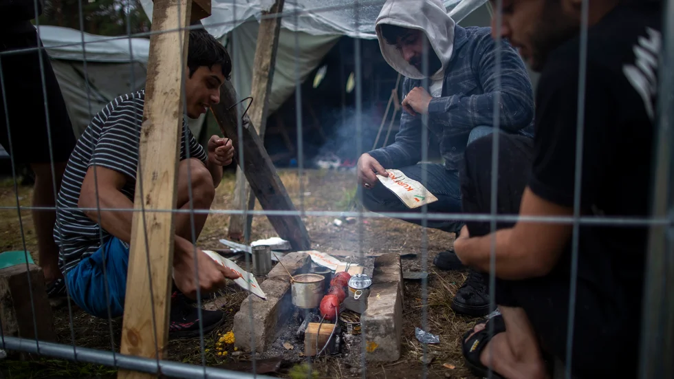 Migranter vid ett nybyggt flyktingläger i Litauen, nära gränsen till Belarus, i augusti 2021. Arkivbild.