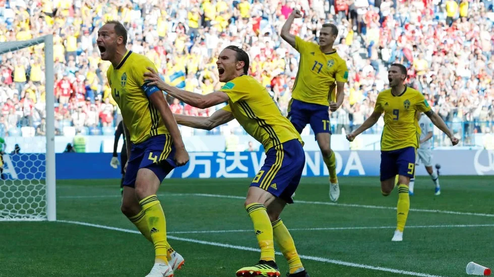 Sweden's Andreas Granqvist, left, celebrates after scoring the opening goal during the group F match between Sweden and South Korea at the 2018 soccer World Cup in the Nizhny Novgorod stadium in Nizhny Novgorod, Russia, Monday, June 18, 2018. (AP Photo/Pavel Golovkin)