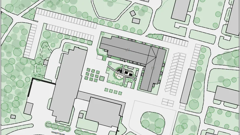 De mörkgrå husbyggnaderna mitt i bild är de som nu ska byggas. 