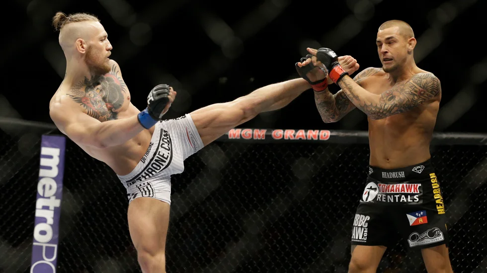 Conor McGregor och Dustin Poirier vid förra mötet i september 2014. Arkivbild