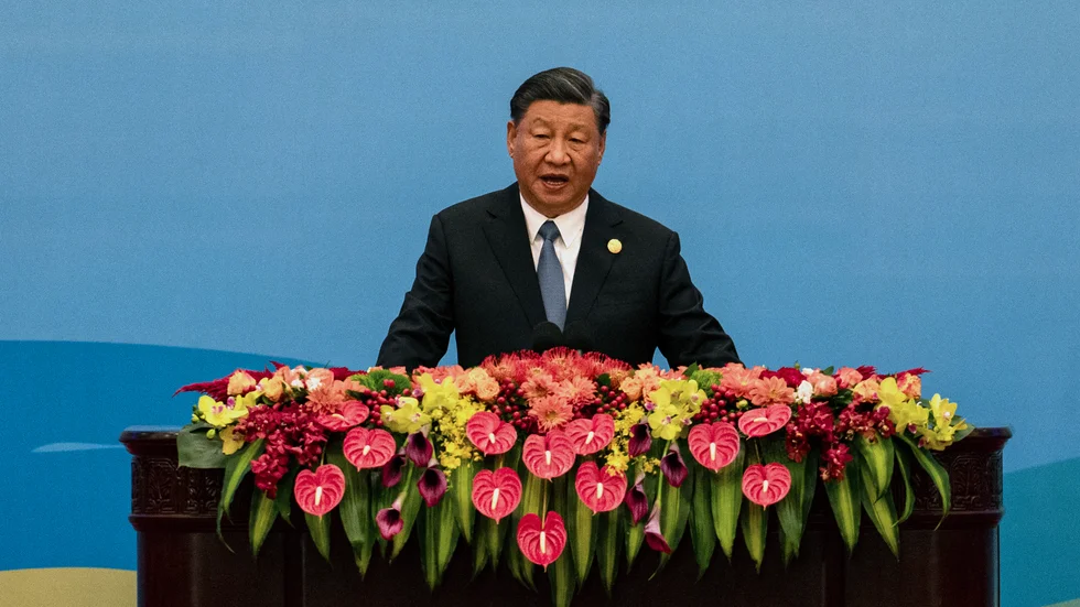 President Xi Jinping i Kina möblerar om i regeringen och öppnar dörren för stora budgetstimulanser. Arkivbild