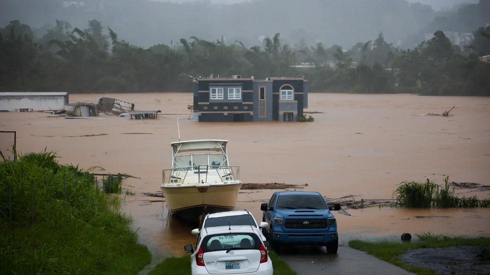Ett bostadshus i puertoricanska Cayey står delvis under vatten till följd av Fionas framfart. Tre personer behövde undsättas ur byggnaden. Bilden togs på söndagen.