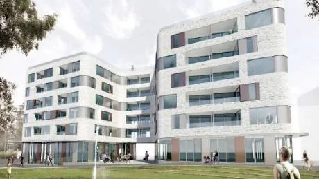 Här ser man de två ihopbyggda planerade hyreshusen bakom Strömparken.