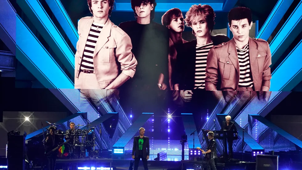 Duran Durans förre gitarrist Andy Taylor kunde inte vara med när bandet valdes in i Rock and Roll Hall of Fame på lördagen.
