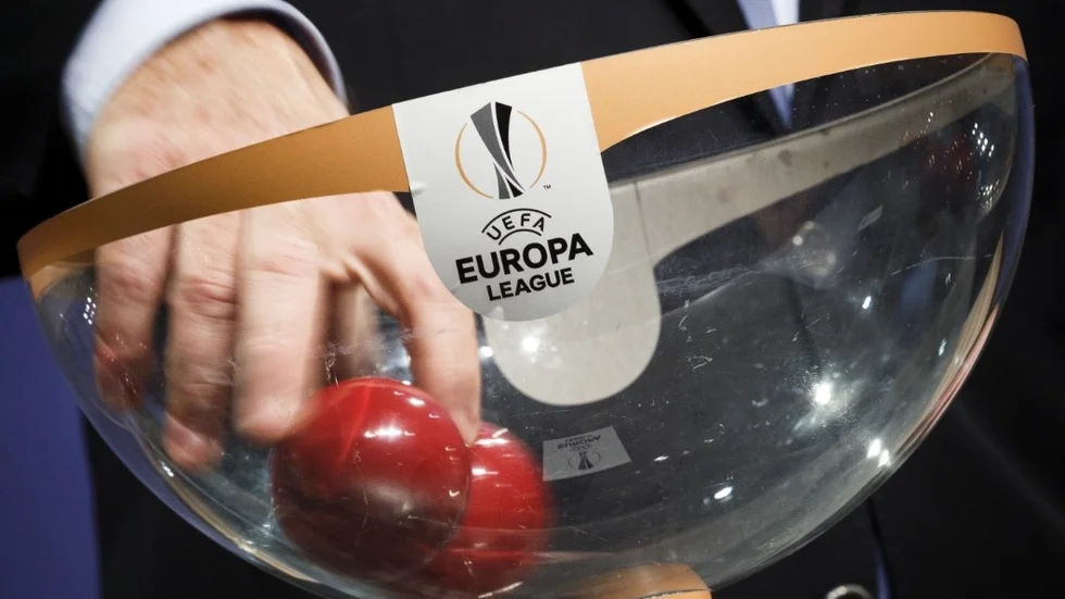 UEFA General Secretary Gianni Infantino picks a ball during the draw of the first qualifying round of the UEFA Europa League 2015/16 at the UEFA Headquarters in Nyon, Switzerland, Monday, June 22, 2015. (Valentin Flauraud/Keystone via AP)