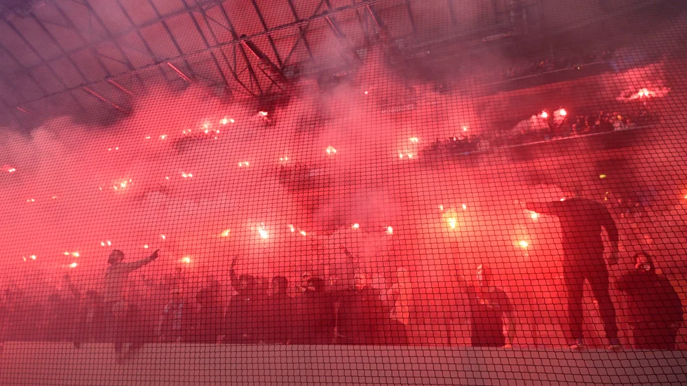 Pyroteknik bland Djurgårdens supportrar på läktaren under söndagens fotbollsmatch i allsvenskan mellan AIK och Djurgården på Friends arena.
